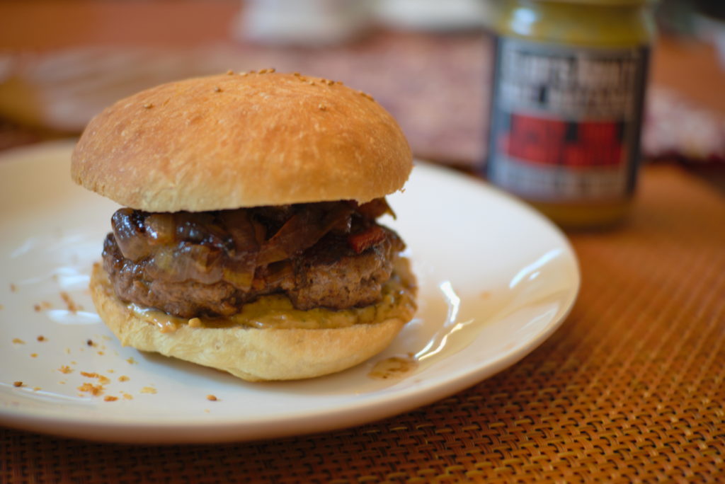 Fully assembled Thai Peanut Butter and Bacon Onion Jam Burger